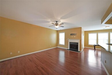 Unfurnished living room featuring hardwood / wood-