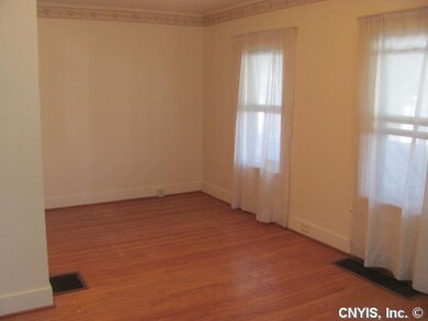 Living Room. The living room has hardwood floors a