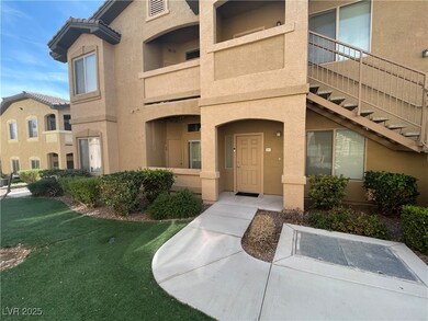 Entrance to property with a yard, a tile roof, and