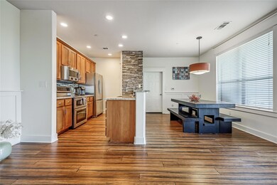 Kitchen featuring dark wood finished floors, a si