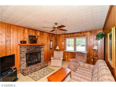 Exterior Front - Family room with brick hearth woo