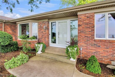 Doorway to property with brick siding