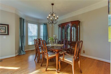 Chandelier, hardwood floors, crown molding