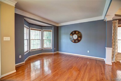 Bay window delightfully extends open Liv Room