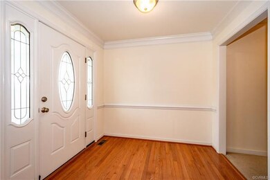 Harwood Floors in Foyer, Crown Moulding.