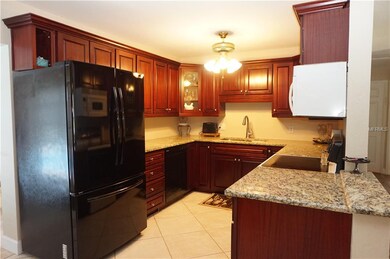 Updated kitchen with beautiful wood cabinetry and 