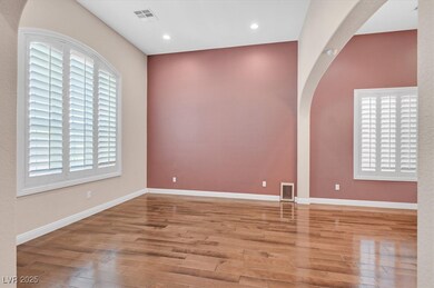 Formal Dining / Living Room framed by dramatic arc