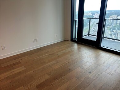Unfurnished room with baseboards and hardwood / w