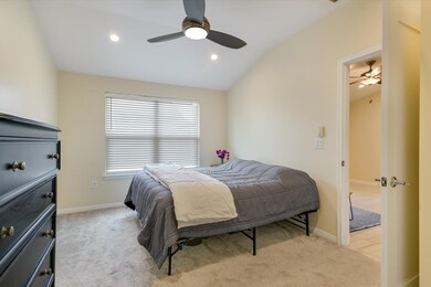 Bedroom with light carpet, lofted ceiling, ceilin