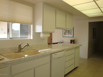 SINK W/ WINDOW OVER LOOKING FRONT PATIO