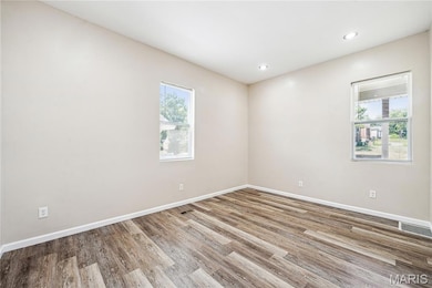 Primary Bedroom with recessed lighting.
