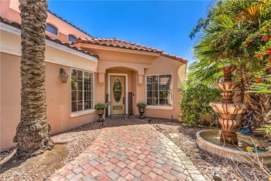 View of exterior entry with stucco siding and a ti