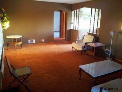 Large and open living room that has a nice bay window to let in lots a natural light!