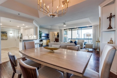 Dining room featuring a raised ceiling, visible ve