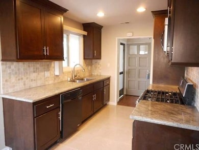 Stunning Kitchen Remodel in Granite and Dark wood 