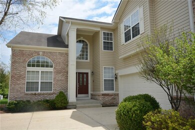 Two story entry with new lighting and a great plant shelf inside