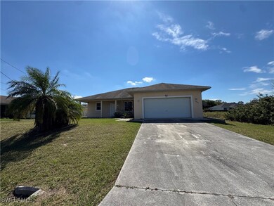 Single story home with an attached garage, stucco