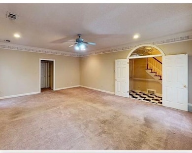 Unfurnished room with ornamental molding, carpet, 