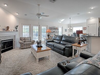 The living room features a natural gas fireplace, 