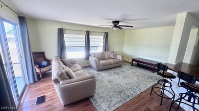 Living room featuring wood finished floors, ceilin