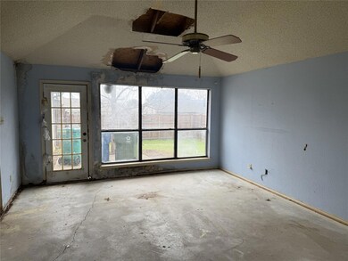 Unfurnished room featuring a textured ceiling
