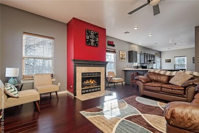 Spacious open concept living area with wood floors