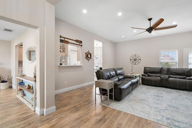 View from entrance. The flooring will be easy to maintain. Sellers removed popcorn ceilings.