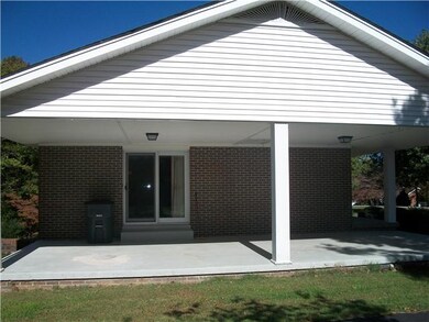 side view w/open concret car port