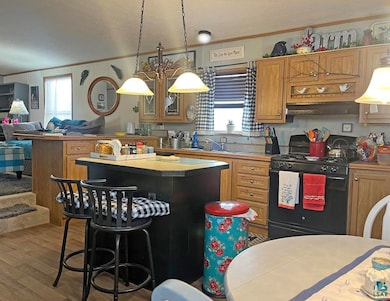Kitchen featuring black gas range, an inviting cha