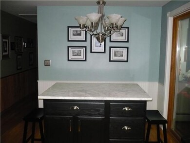 Kitchen. Kitchen island with marble countertop.