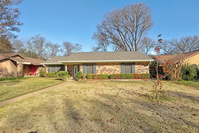 Ranch-style house with a front lawn