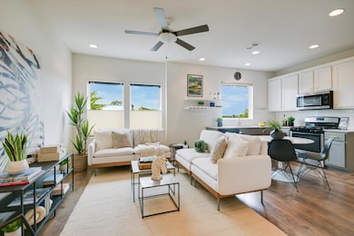 open living/kitchen area with 9ft ceilings.