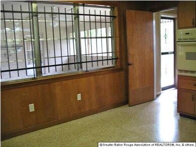 Kitchen overlooks screened room