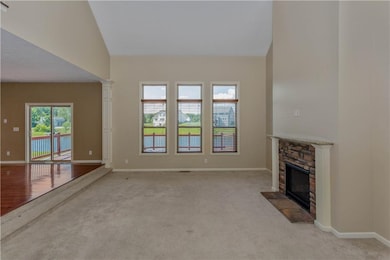 2 story great room with view of pond and open to kitchen
