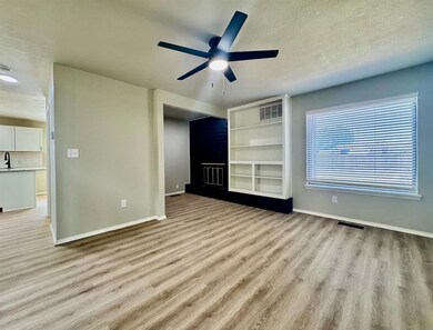 Unfurnished living room with wood finished floors,