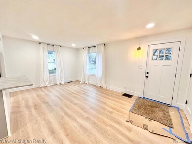 Foyer entrance featuring light wood-style flooring and recessed lighting