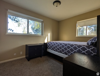 Carpeted bedroom with baseboards