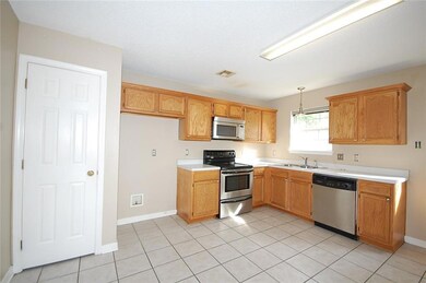 Kitchen features pantry & stainless steel applianc