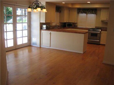 Looking towards dining area and kitchen from entry