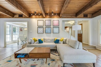 Living area featuring a wood ceiling with exposed