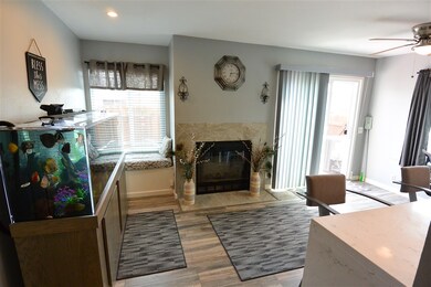 LARGE LIVING ROOM WITH TILE FIREPLACE