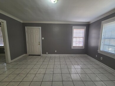 Empty room with baseboards and ornamental molding