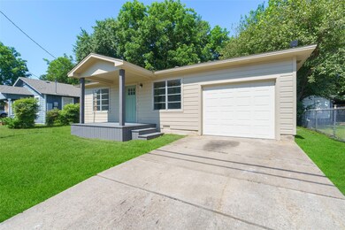 Ranch-style home with a garage and a front yard