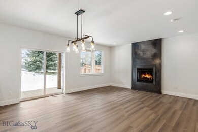 Unfurnished living room featuring a large fireplac