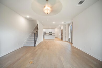 Unfurnished living room with light wood-style flo