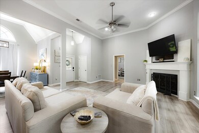 Living area with light wood finished floors, ceili