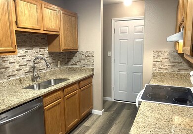 This kitchen features granite countertops, a doubl