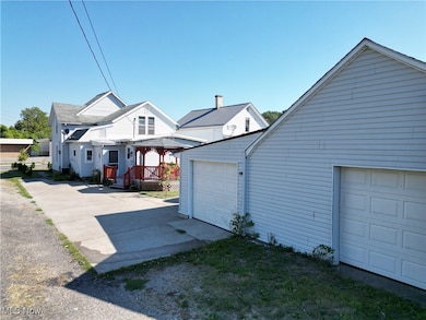 View of property exterior with a garage