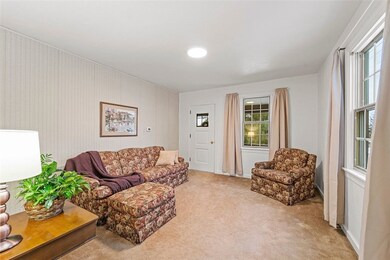 Easy access to covered side porch from the cozy li
