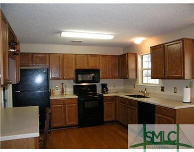 Kitchen. Hardwood Floors-Corian Counter